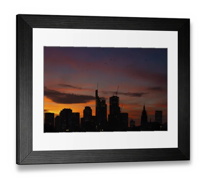 Framed Print : The silhouette of Frankfurt's banking skyline stands out against the luminous evening sky in the evening after