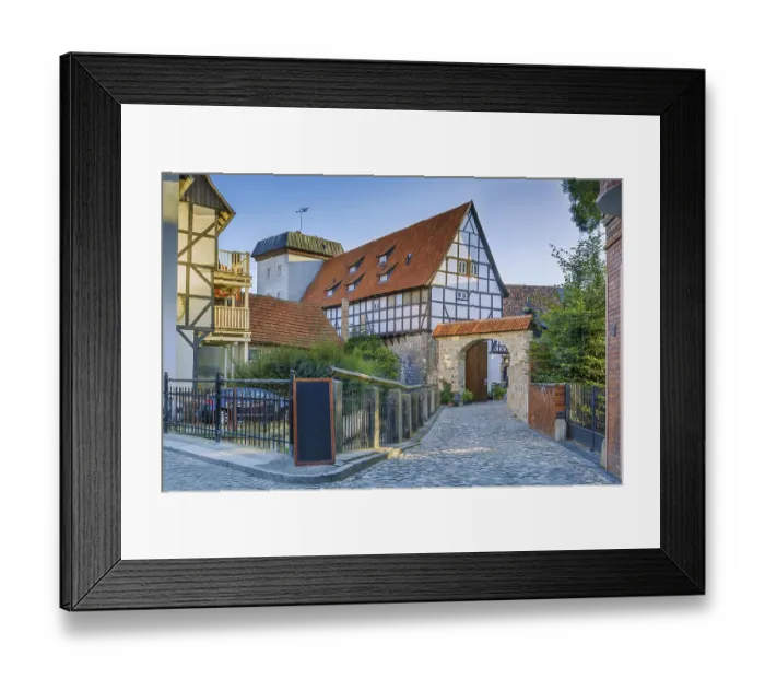 Framed Print : Sstreet with historical half-timbered houses in Quedlinburg