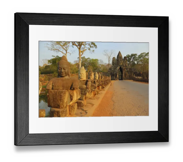 Framed Print : Stone carved statues of Devas on the bridge to Angkor Thom