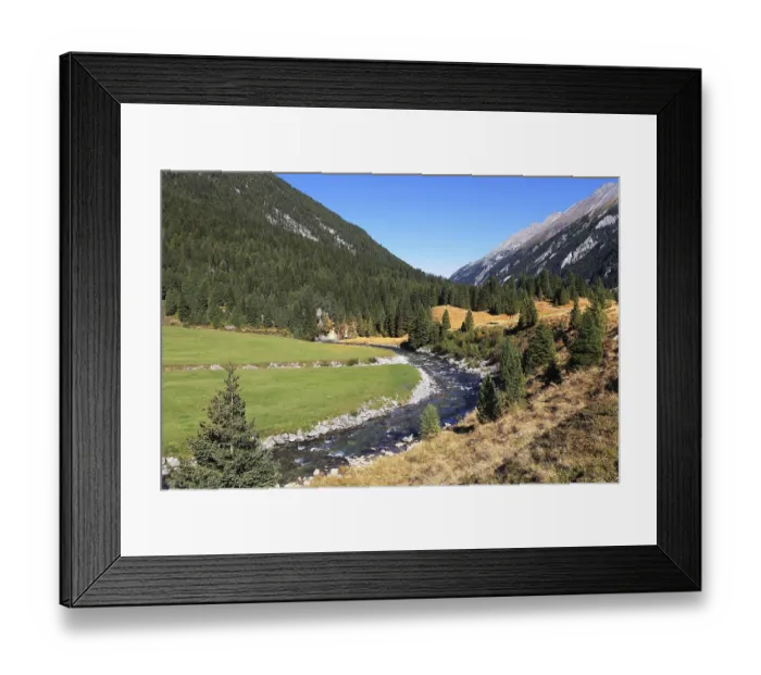 Framed Print : Headwaters of waterfalls - the narrow fast river among green mountain meadows