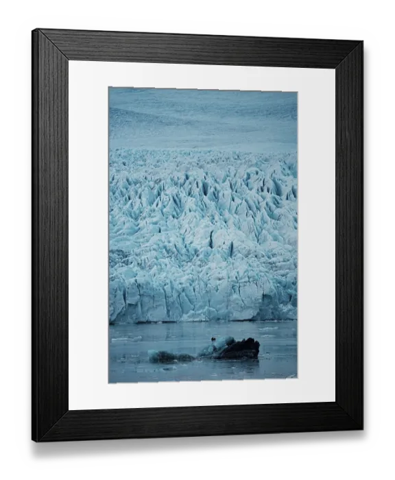 Framed Print : Imposing glacier with intricate ice formations reflecting in tranquil water
