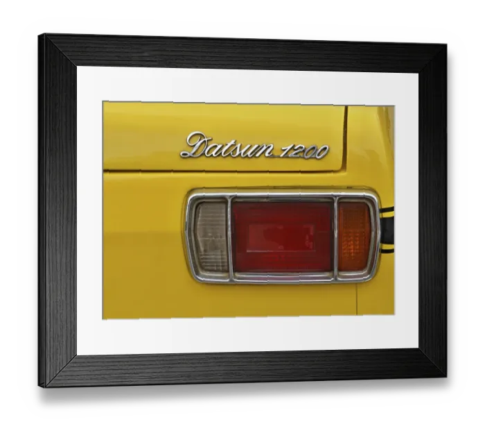 Framed Print : Detail, rear light and lettering of a Daatsun 1200 from the 70s