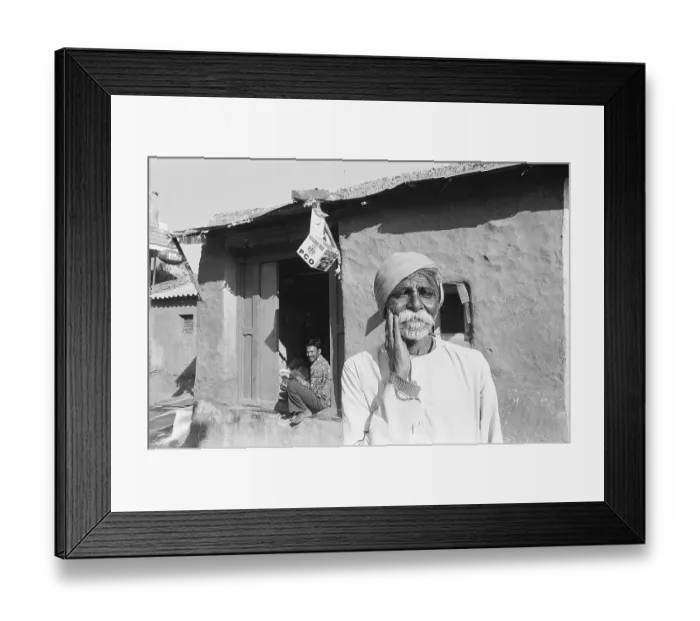 Framed Print : Rural man standing outside of his house