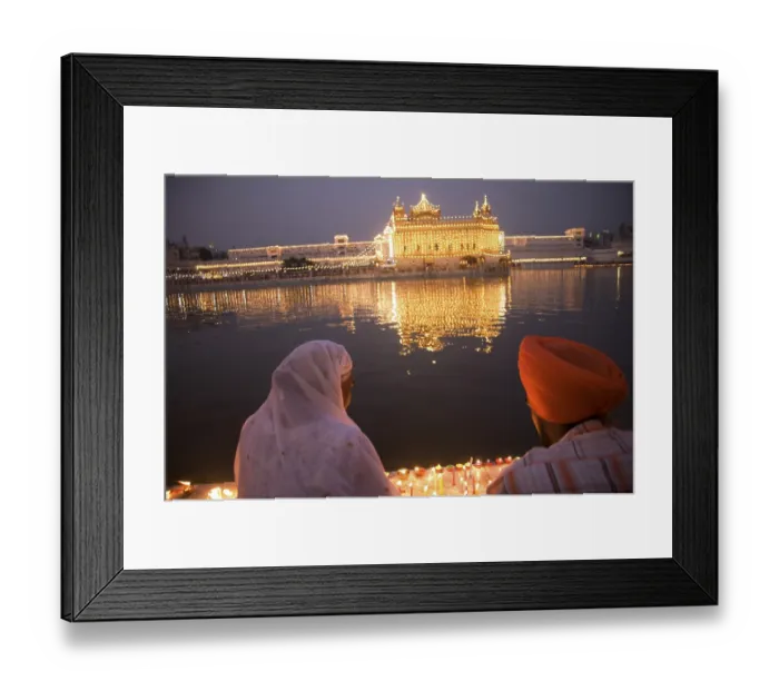 Framed Print : Sikh couple sitting holy water