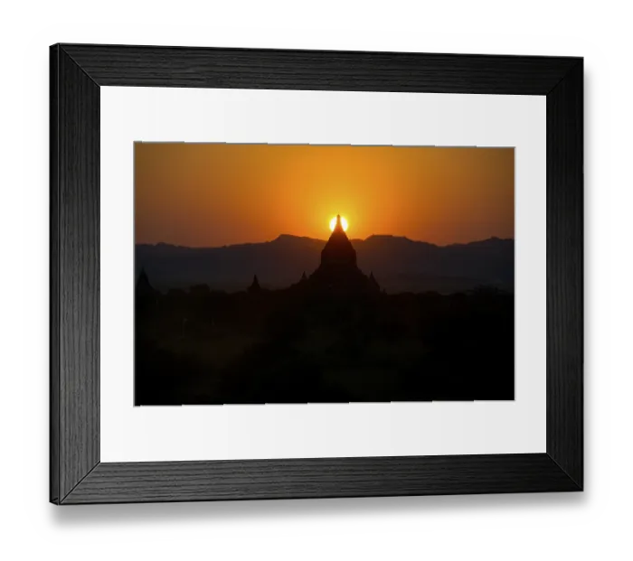 Framed Print : Sundown over the tip of a stupa Bagan Burma