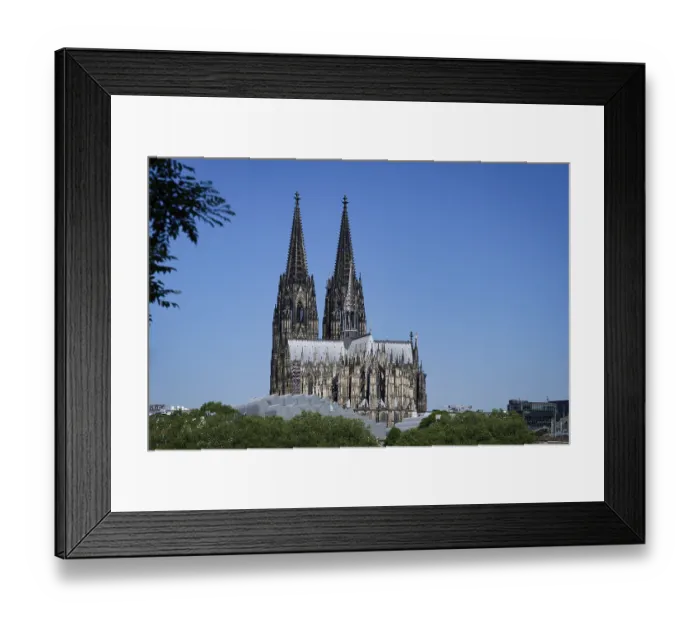 Framed Print : The imposing cathedral sits enthroned on a hill above Cologne's historic city centre