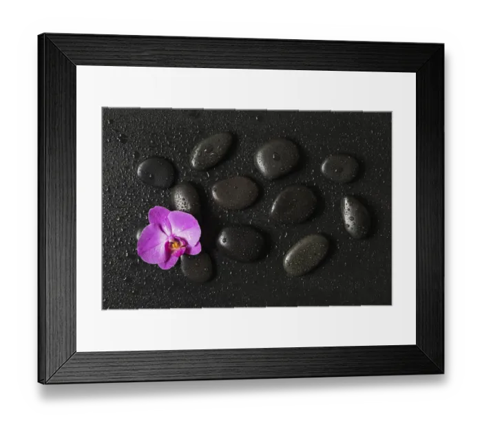 Framed Print : Spa concept with black basalt massage stones arranged on a black background Framed Print : Spa concept with black basalt massage stones arranged on a black background