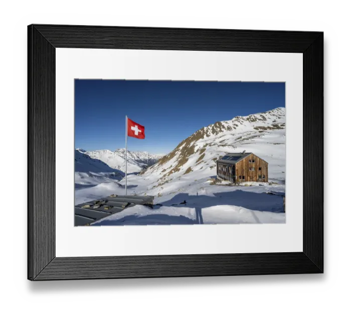 Framed Print : Swiss flag and mountain hut Keschhutte in front of mountain landscape in winter Framed Print : Swiss flag and mountain hut Keschhutte in front of mountain landscape in winter