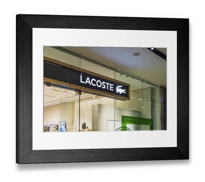 Framed Print : Lacoste clothing store entrance in a shopping mall