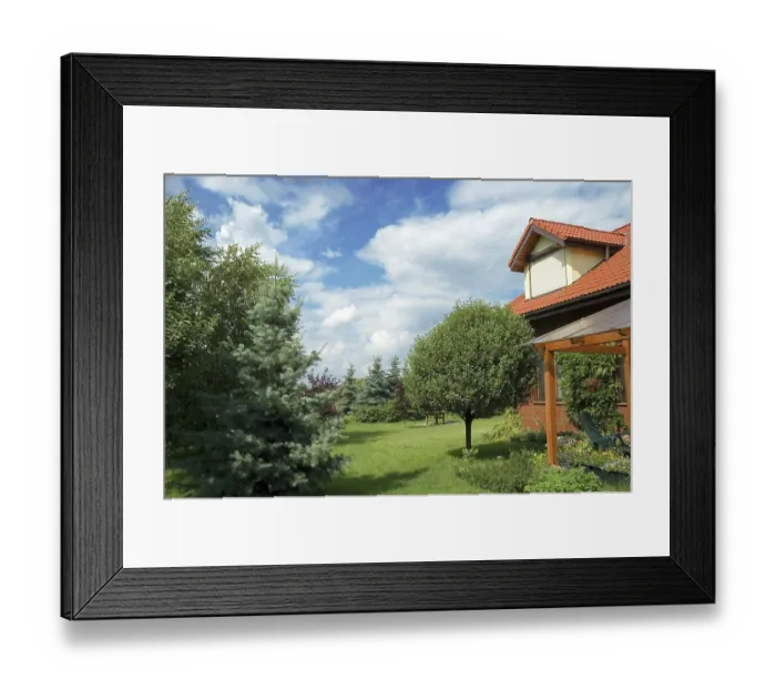 Framed Print : Perfectly manicured home with garden