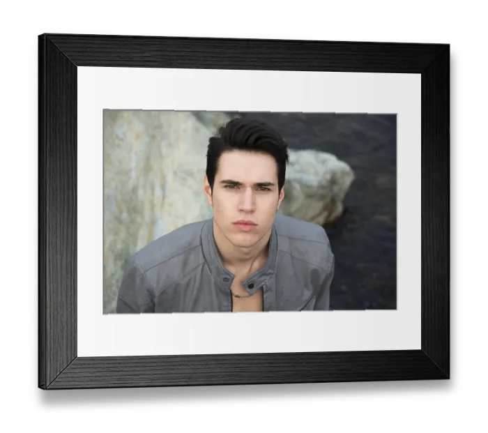 Framed Print : Headshot of attractive young man outdoor looking up at camera
