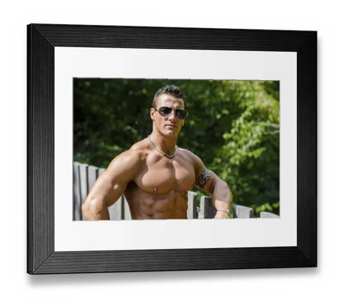 Framed Print : Attractive young muscleman outdoors