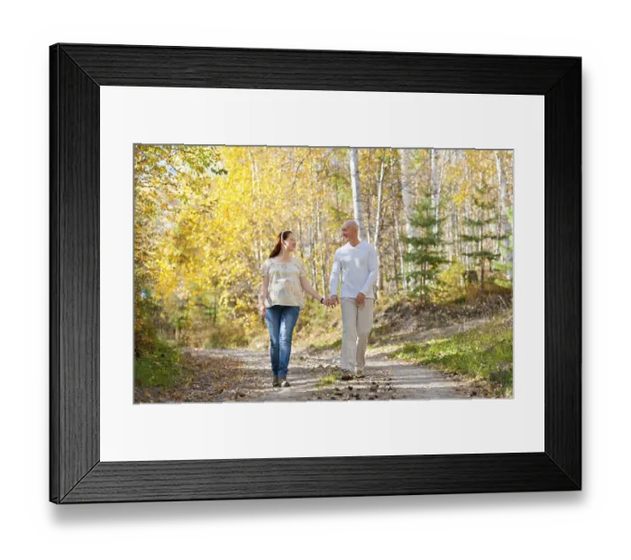 Framed Print : Happy married couple - husband and his pregnant wife walk in autumn forest