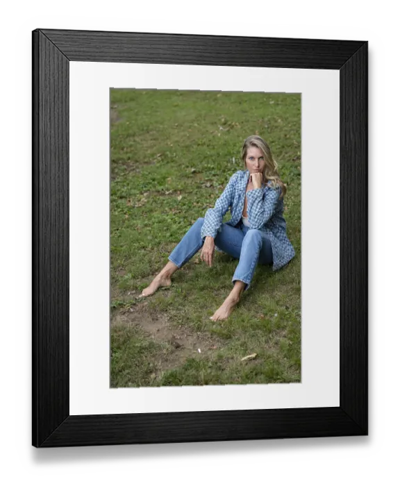 Framed Print : A beautiful blonde model enjoys the late summer sun outdoors
