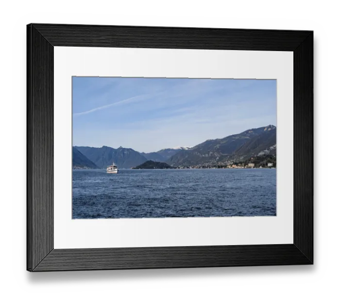 Framed Print : Ferry sails on Lake Como with mountains in the background