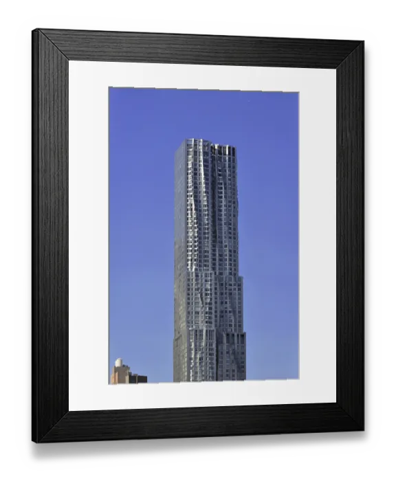 Framed Print : Modern skyscraper against a clear blue sky