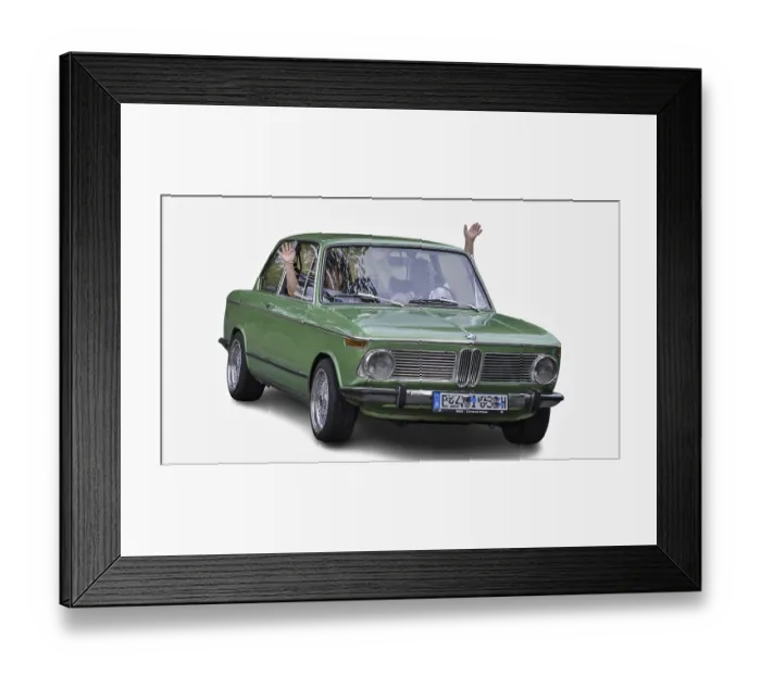 Framed Print : Senior couple waving from vintage green BMW during a summer road trip