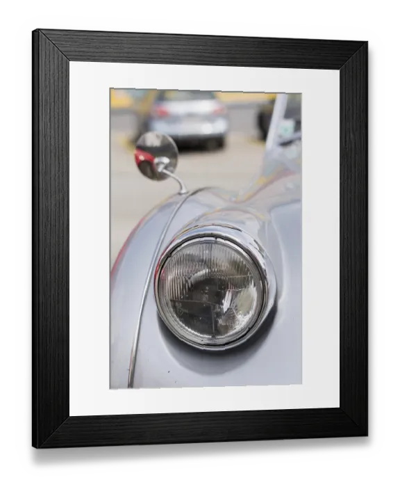 Framed Print : Classic car - Headlights and rear-view mirror of a classic car in view