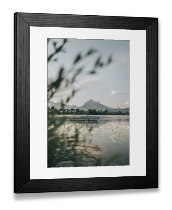 Framed Print : Quiet lake with a jetty, surrounded by mountains and trees