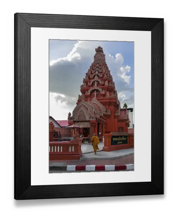 Framed Print : Monk in front of the Khmer-style City Pillar Lak Muang Framed Print : Monk in front of the Khmer-style City Pillar Lak Muang