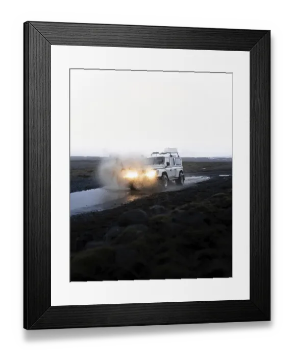 Framed Print : White Land Rover in action with splashing water