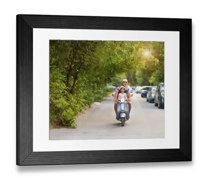 Framed Print : Happy young father and little daughter riding a vintage scooter in the street wearing hats