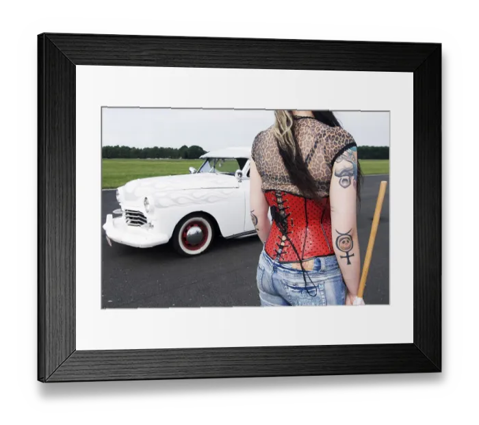 Framed Print : Starter girl with a red corsage and tattoos next to a white limousine