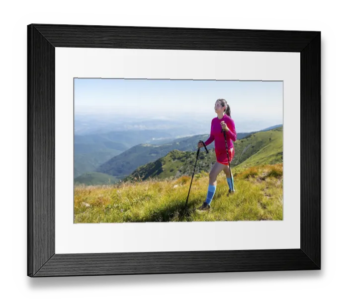 Framed Print : Young woman in pink trekking in the mountain