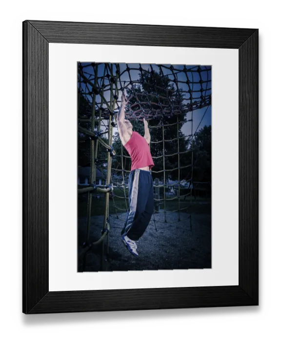 Framed Print : Young man by training at outdoor fitness facility