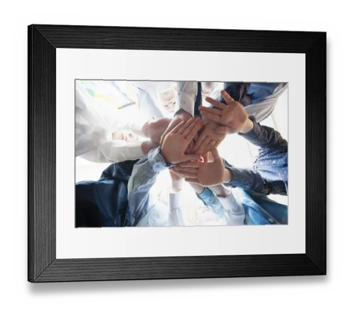 Framed Print : Bottom view of young boys putting their hands together as a symbol of friendship Framed Print : Bottom view of young boys putting their hands together as a symbol of friendship