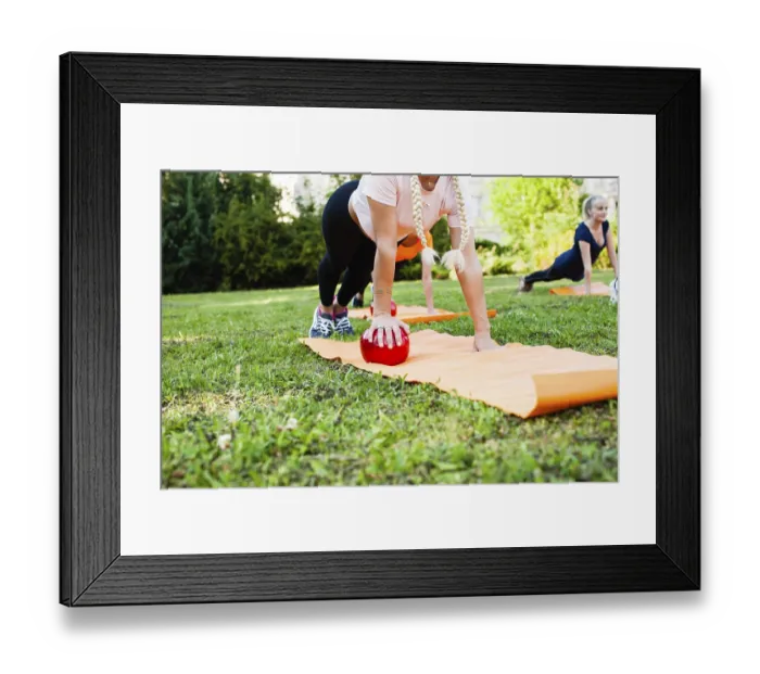 Framed Print : Women in the park are doing exercise with fitness balls
