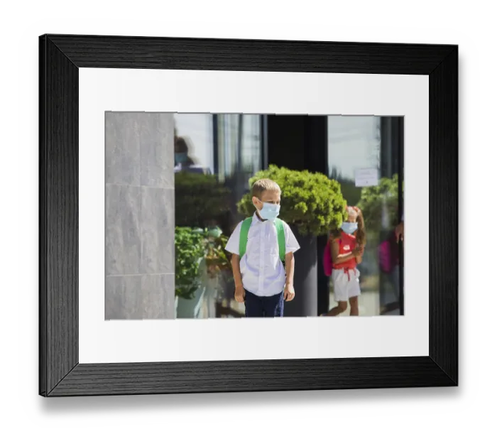 Framed Print : The elementary school student wearing a protective mask and backpack Framed Print : The elementary school student wearing a protective mask and backpack
