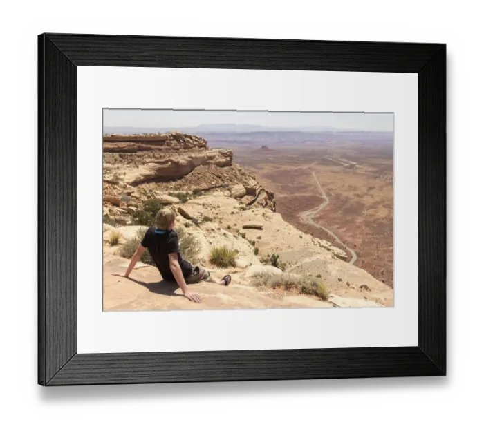 Framed Print : Youngster enjoying the view of the deserts of Monument valley in Arizona Utah in USA