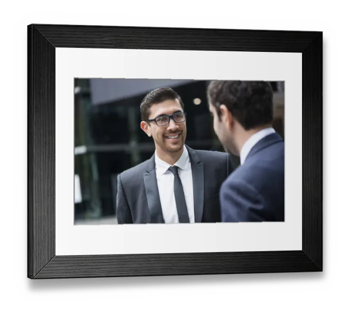 Framed Print : Two businessmen talking outdoors while taking coffee break