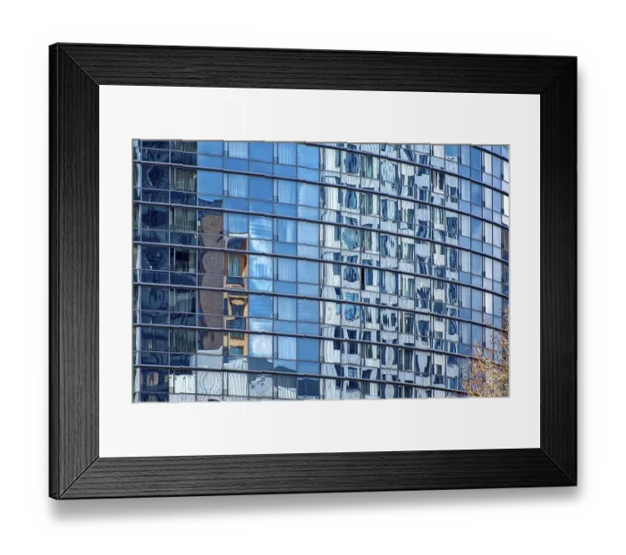 Framed Print : The shimmering blue, rounded, glass facade of a modern office tower Framed Print : The shimmering blue, rounded, glass facade of a modern office tower