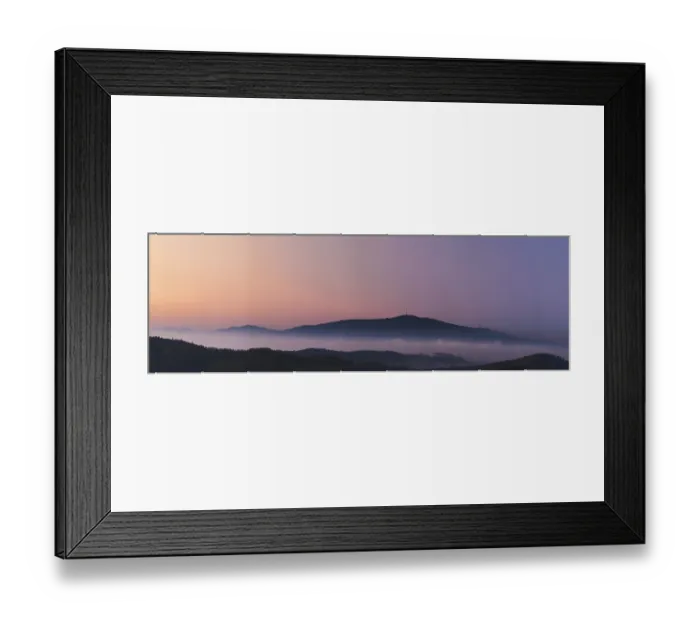 Framed Print : Misty landscape at sunset, mountains rising from clouds of fog in the background