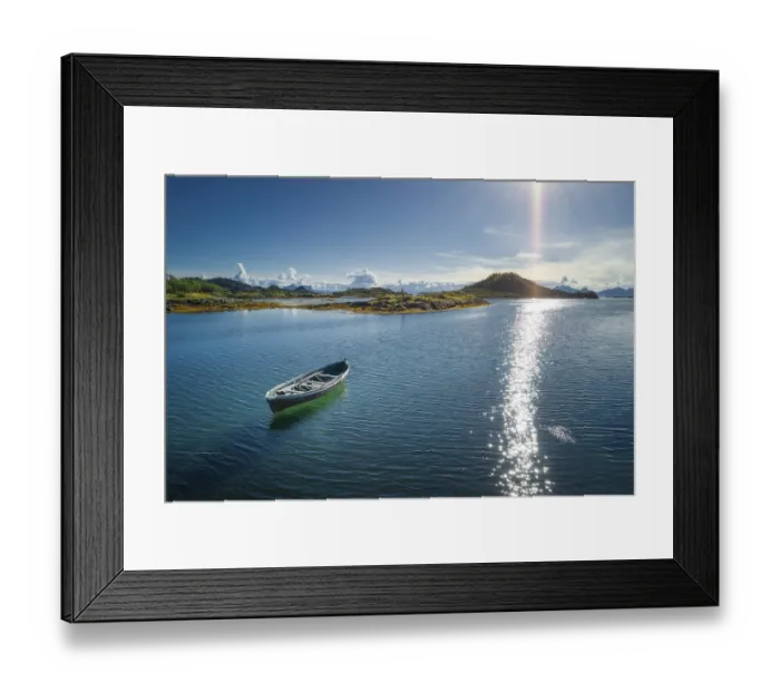 Framed Print : Small wooden boat between skerries in the sea Framed Print : Small wooden boat between skerries in the sea