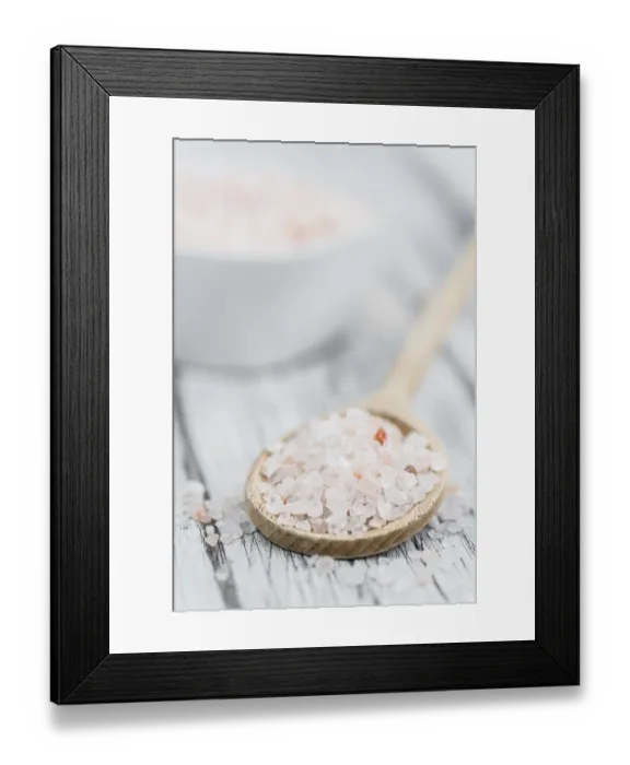 Framed Print : Salt (pink) on an old wooden table as detailed close-up shot (selective focus)