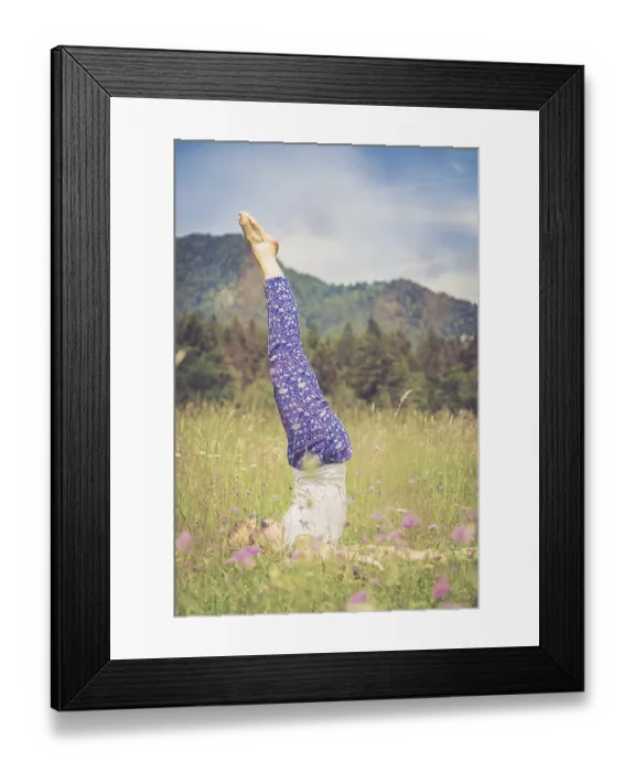 Framed Print : Young girl is doing yoga in the park