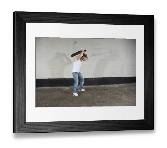 Framed Print : Angry skateboarders wants to break his board