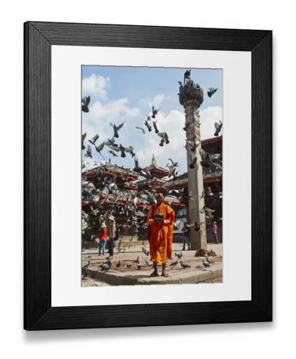 Framed Print : Buddhist monk with a begging bowl standing in front of Hindu temples Framed Print : Buddhist monk with a begging bowl standing in front of Hindu temples