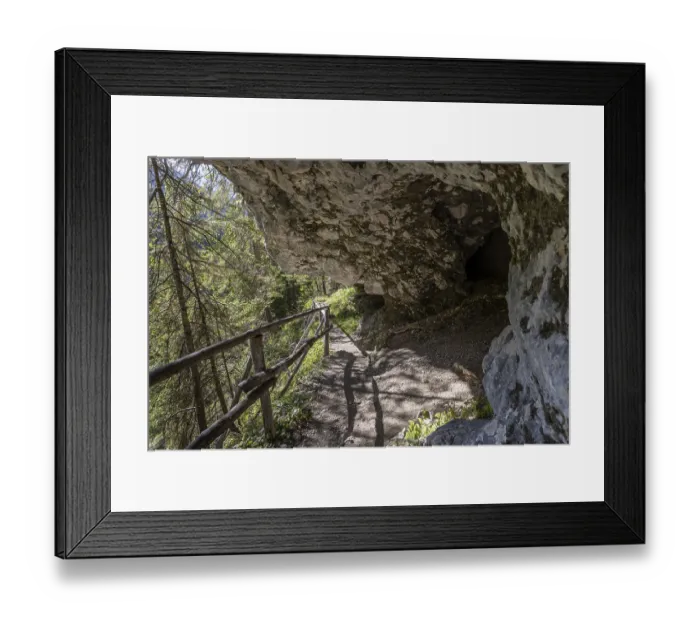 Framed Print : Alpine hiking trail on the rock with grotto cave