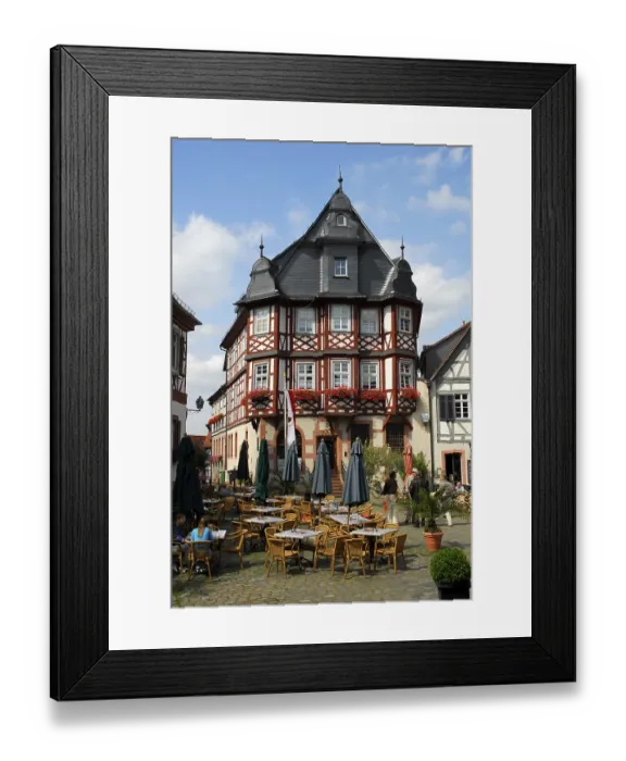 Framed Print : Bar cafe terrace, half-timbered houses in the back Framed Print : Bar cafe terrace, half-timbered houses in the back