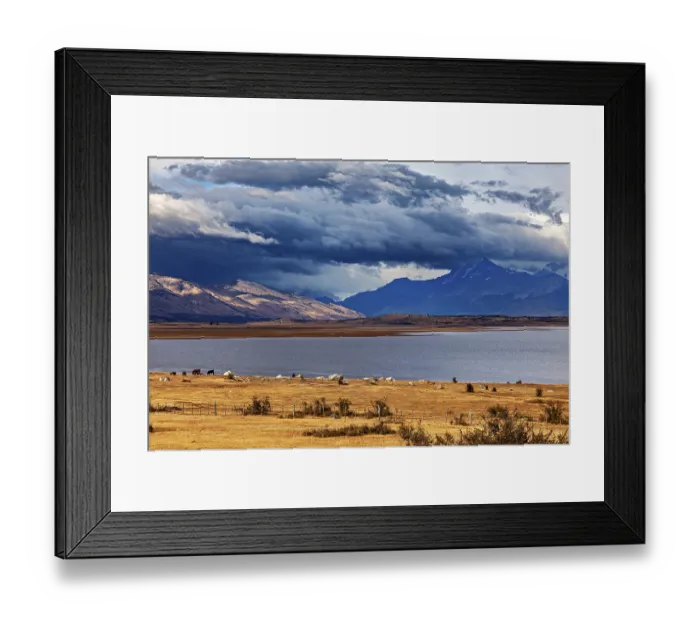 Framed Print : A wide lake under dramatically threatening clouds Framed Print : A wide lake under dramatically threatening clouds