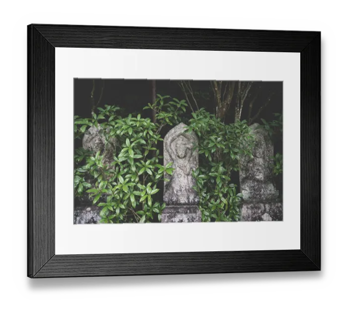 Framed Print : Three old buddhist statues covered in green leaves at Daisho-in temple in Miyajima