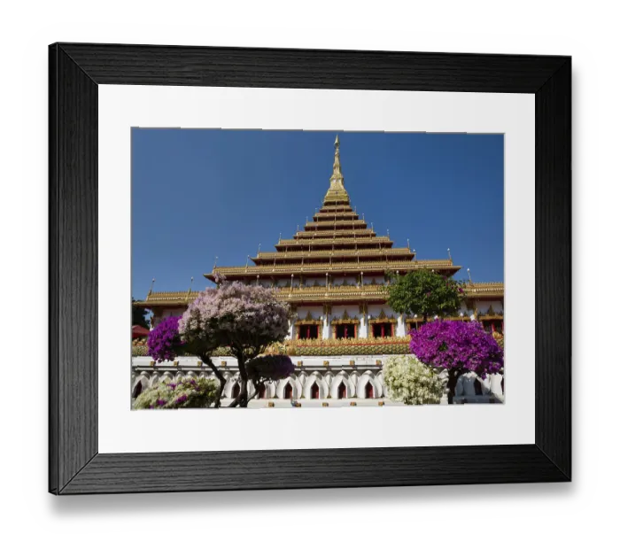 Framed Print : Flowering bushes in front of nine-story stupa Phra Mahathat Kaen Kakhon