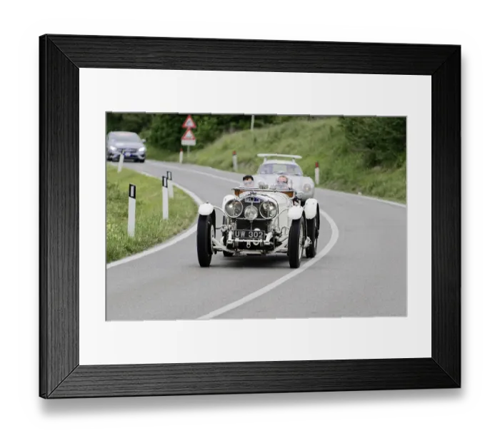 Framed Print : A classic white vintage racing car on a winding country road