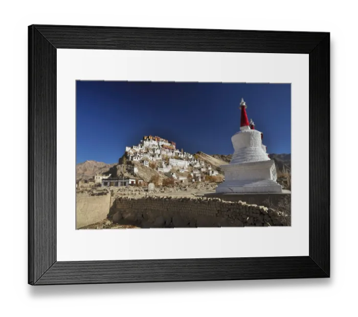 Framed Print : Thiksey monastery bathing in sunlight surrounded by mountains