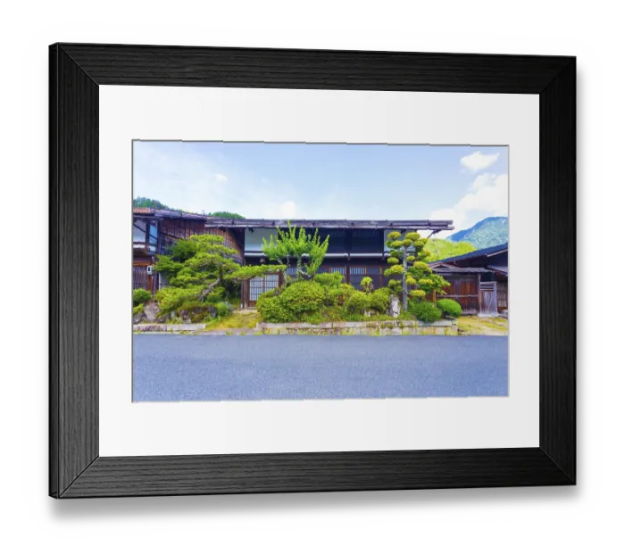 Framed Print : Front of a traditional wooden house with neatly manicured Japanese garden on the Nakasendo route in Tsumago Framed Print : Front of a traditional wooden house with neatly manicured Japanese garden on the Nakasendo route in Tsumago