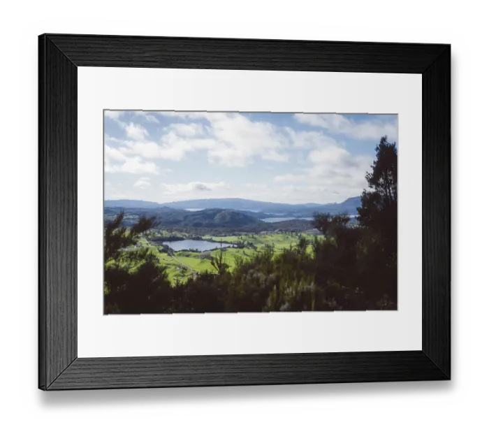 Framed Print : View of hilly landscape with lake